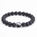 Detail of 8mm matte black stone beads with a classic Yin Yang charm on an elastic cord - Black Matte Stone (Tai Chi Pendant)