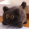 Cute dark brown plush cat toy with yellow embroidered eyes on a wooden table - Black Cat 11cm