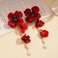 Macro detail of red fabric flower earrings with golden chain and white pearl tassels - Silver Earring Post - Red