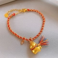 Red braided rope bracelet with a gold horse pendant and zircon heart charm - Zircon Heart Pony