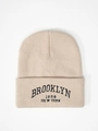 Detail of Brooklyn 1898 New York embroidery on beige ribbed knit beanie hat - One Size / Beige