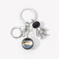 Detail of silver astronaut keychain with galaxy glass pendant on a white background - Colorful Galaxy-5