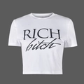 Close-up of 'RICH bitch' print on white crop top t-shirt showing fabric texture and detail - S / White