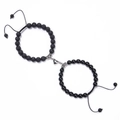 Detail of heart magnetic charms on black volcanic stone beaded bracelets for couples - Lava Stone + Black Agate
