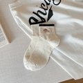 Cute off-white crew socks with colorful speckles and dog embroidery for women - One Size / Black Edge