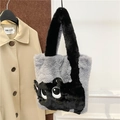 Detailed view of plush cat tote bag featuring grey and black faux fur with big eyes - Gray