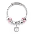 Detailed shot of silver crown charm bracelet with pink beads and tree of life pendant - No Box / Tree of Life
