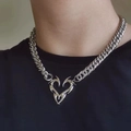 Close-up of a silver punk flame heart pendant on a chunky cuban link chain necklace - 18# Necklace—Heart Totem