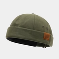 Detailed macro view of olive green canvas miki hat featuring a brown leather 'DAD' patch - Adjustable / DAD Patch Army Green