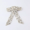 Detailed close-up of handmade bow hair clip with luxury rhinestones and pearl accents - Cream Velvet with Full Rhinestones