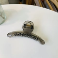 Detail of translucent tea-grey curved hair claw clip with a strong metal spring mechanism - Transparent Black