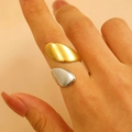 Detailed view of two-tone 18K gold and silver plated irregular open ring on hand - 18K Gold Two-Tone Water Drop (1165)