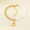 Detail view of heart pendant with angel wings on pearl and gold link chain bracelet - Angel Wings Heart (KB203711-Z)