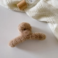 Close-up of a plush light brown hair claw clip with soft texture on a white background - Crossed / Brown