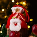 Christmas gift bag featuring 3D plush Santa Claus with striped hat and golden star - Cartoon Santa Claus Style