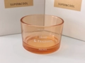 Amber glass aroma diffuser jar with white lettering against white packaging boxes - Orange Glass Empty Cup