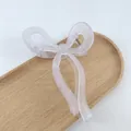 Matte jelly light purple bow hair claw clip with golden spring on a wooden tray - Matte Jelly Light Purple