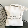 Canvas tote bag with butterfly print resting on a black mesh chair in a minimalist setting - Quote & Flower 3-R31