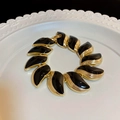Golden butterfly flower bracelet with black enamel inlays on white ceramic tray - 69# Gold Leaves Black Enamel Bracelet