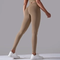 Back view of seamless high-waist yoga leggings in earthy brown for fitness and gym - S / Pants / Cocoa