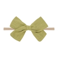 Detail of soft olive green fabric bow on beige nylon elastic baby headband - Olive Green