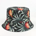 Detail view of double-sided bucket hat with vibrant tropical floral and palm leaf print - M (56-58cm) / Flower