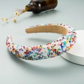 Fashion wide crystal headband with colorful rhinestones on a white display stand - Colorful