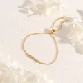 Close-up of adjustable gold box chain bracelet with sparkling zircon bar inlay - Gold With Clear Zirconia Bar