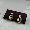 Orecchini minimalisti in argento S925 con doppio anello e finitura in oro 18 carati - Argento 925 / Oro