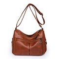 Brown multi-zippered crossbody shoulder bag in soft pebbled leather with adjustable strap - Tan