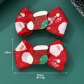 Detail view of red Christmas bow hair clips with Santa Claus print and sequined sock - Christmas Stocking Bow Hair Clip