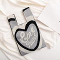 Knit tote bag featuring a black heart pattern and Love Yoursey text in gray and white - Black-Heart