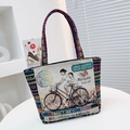 Ethnic canvas tote bag featuring rabbit embroidery and Penang mural artwork with rainbow straps - Bicycle