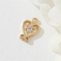 Macro shot of 14K gold plated heart charm with sparkling cubic zirconia inlay - White Zirconia Heart (H-0705)