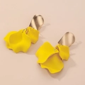 Minimalist yellow flower petal earrings with gold needles on light pink background - Yellow