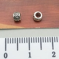 Silver tibetan spacer beads with cloud relief patterns and ruler for size comparison - Swirl Cloud Pattern Spacer Bead