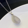 Close-up of teardrop pendant necklace featuring sparkling white zircon pavé setting - Silver (8307)