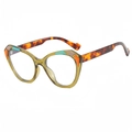 Cat eye sunglasses featuring olive yellow frames and colorful geometric paneling - Green Frame