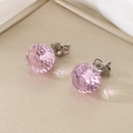 Macro shot of pink faceted crystal stud earrings with silver-tone metal backings - 12mm Silver Base Pink Faceted Crystal