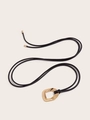 Detail of minimalist black soft leather cord belt with irregular gold geometric buckle - Black-Oval Buckle
