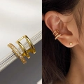 Triple-layered gold ear cuff with zircons for non-pierced ears shown on model - MY31324-Gold Three Layer Rhinestone Single