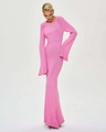 Close-up of pink knitted long dress with ruffled hem and slim fit mermaid silhouette - S / Pink