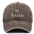 Detailed close-up of white Aries zodiac embroidery on vintage washed cotton baseball cap - Coffee