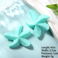 Close-up of mint green resin starfish accessories with realistic textures and dimensions - Large Blue Sea Star