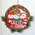 Christmas rattan wreath featuring three snowmen and a red Let It Snow banner sign - Knit Hat Snowman Large
