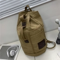 Khaki canvas bucket backpack for men featuring adjustable straps and top handle design - Khaki Small