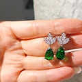 S925 silver pear-cut emerald green zircon earrings shown on hand for size reference - Green Diamond Teardrop Earrings Led-91