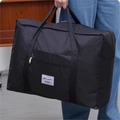 Large capacity black oxford fabric travel bag shown with sturdy handles and zipper closure - Medium / Black