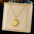 Detailed shot of golden sun face pendant necklace with ball chain in a beige display box - Sun Face Style (N3564)