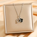 Detail of double-layer clover pendant with black enamel and pavé cubic zirconia - Silver / Black Shell (8403)
